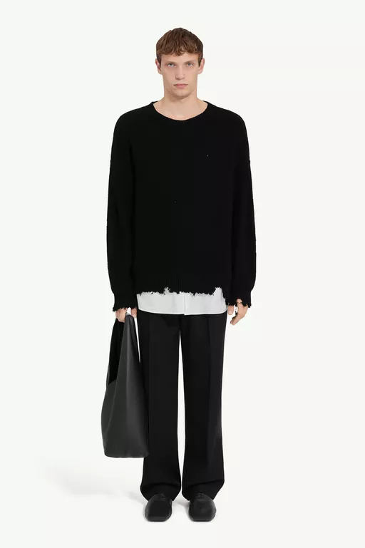 Distressed hem sweater