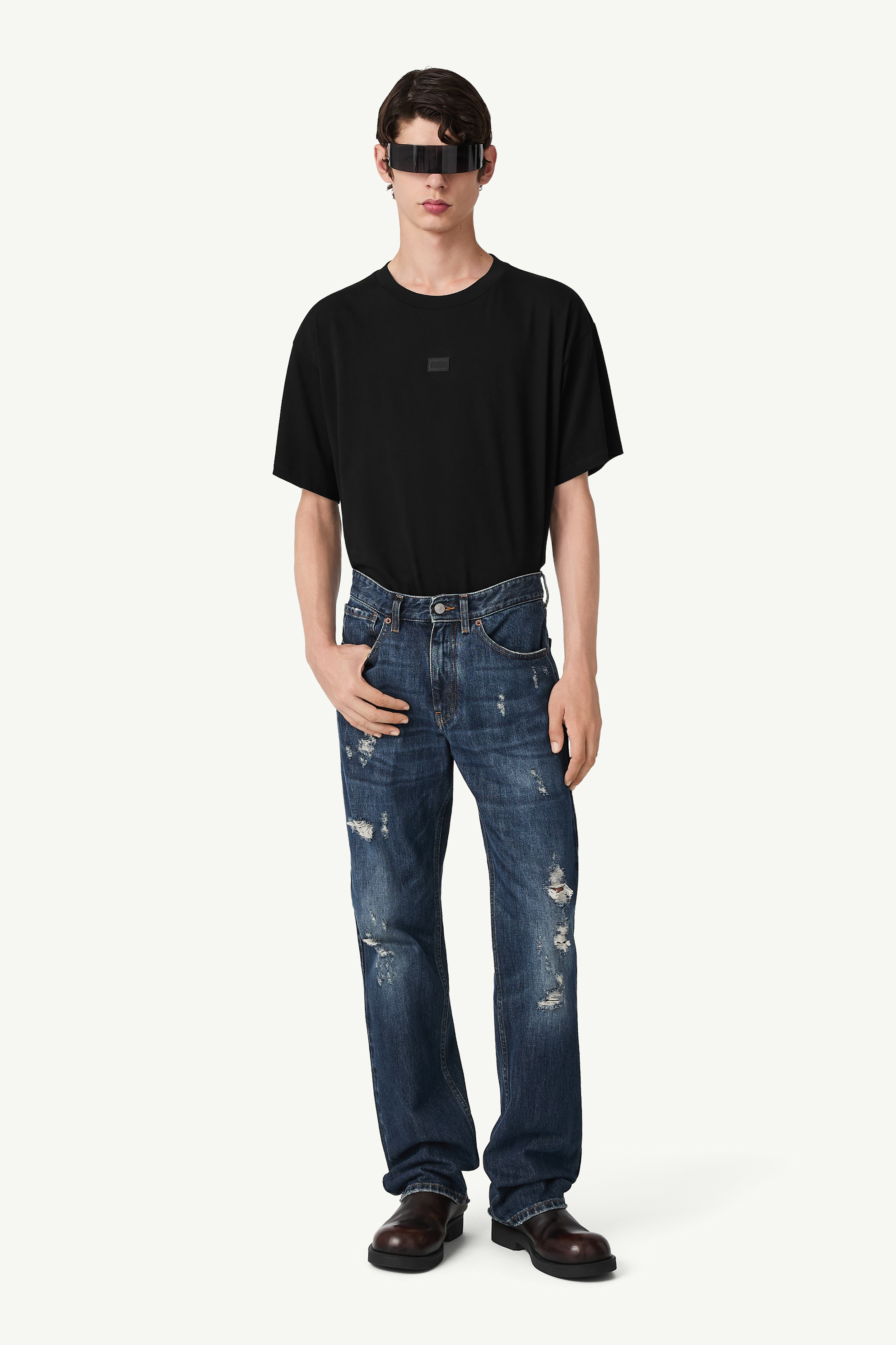Distressed wash denim jeans
